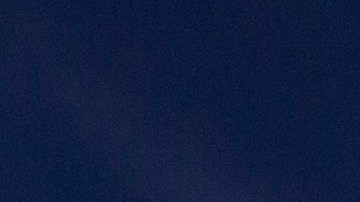 In this March 30, 2012 photo, an Immigration and Customs Enforcement (ICE) agent waits with other agents outside of the home of a suspect before dawn as part of a nationwide immigration sweep in San Diego. Federal officials say they arrested more than 3,100 immigrants convicted of serious crimes and fugitives in a six-day nationwide sweep. Officials at U.S. Immigration and Customs Enforcement say the sweep included every state and involved more than 1,900 of the agencys officers and agents. (AP Photo/Gregory Bull)