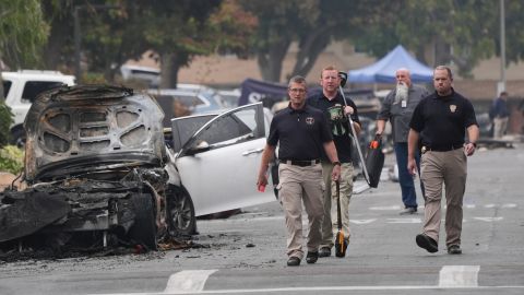 Investigators work at the site of a plane crash Friday, May 23, 2025, in San Diego. (AP Photo/Gregory Bull)