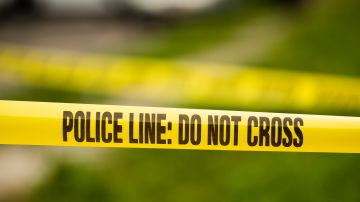 Tape cordons off the scene of a shooting in the Ogontz section of Philadelphia, Thursday, Aug. 15, 2019. (AP Photo/Matt Rourke)