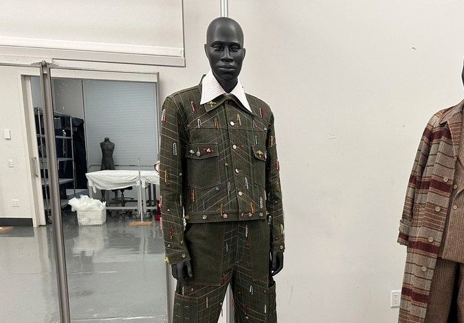 Designs by Jacques Agbobly, left, and Jeffrey Banks, intended for the upcoming Costume Institute exhibit, “Superfine: Tailoring Black Style," appear in the installation room at the Metropolitan Museum of Art in New York on March 20, 2025. (AP Photo/Jocelyn Noveck)