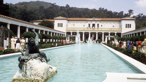 Visitors walk beside a pool in the Jean Paul Getty Museum in Malibu, California, United States in 1984. On either side are Greek and Roman antiquities, the main concern in this part of the 2-floor establishment. A floor above has decorative arts from the 13th, to the early 20th centuries. The museum was opened at its present site in 1974 as a recreation of the Villa dei Papiri, a first century Roman villa which stood on the slopes of Mount Vesuvius, near Herculaneum. Getty, an oil magnate, founded the collection and left it $1.3 billion when he died in 1976. (AP Photo/Emily Lane)