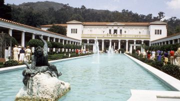 Visitors walk beside a pool in the Jean Paul Getty Museum in Malibu, California, United States in 1984. On either side are Greek and Roman antiquities, the main concern in this part of the 2-floor establishment. A floor above has decorative arts from the 13th, to the early 20th centuries. The museum was opened at its present site in 1974 as a recreation of the Villa dei Papiri, a first century Roman villa which stood on the slopes of Mount Vesuvius, near Herculaneum. Getty, an oil magnate, founded the collection and left it $1.3 billion when he died in 1976. (AP Photo/Emily Lane)
