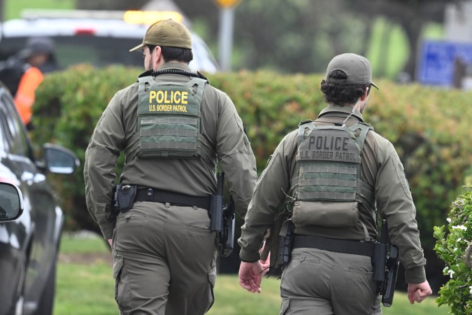 U.S. Border Patrol agents search Seagrove Park in Del Mar after a boat capsized Monday, May 5, 2025, at Torrey Pines State beach in San Diego, Calif. (AP Photo/Denis Poroy)