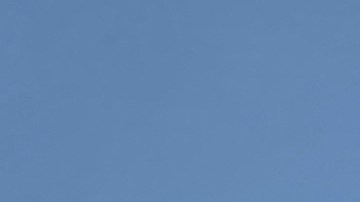 RETRANSMISSION TO CORRECT YEAR TO 2022 - A runner is silhouetted under the rising sun on a hot morning Friday, Sept. 2, 2022 in Santa Monica, Calif. (AP Photo/Brian Melley)