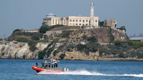 A U.S. Coast Guard boat goes by Alcatraz Island on Tuesday, Oct. 1, 2013, in San Francisco. Alcatraz Island, which is part of the U.S. National Parks Service, is closed to visitors due to government shutdown. (AP Photo/Marcio Jose Sanchez)