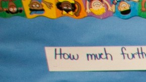 In this photo taken Tuesday, May 15, 2012, Partnership for Los Angeles Coordinator of School Improvement Myeisha Phillips, middle, supervises Ritter Elementary School elementary students practicing their math operator skills in Los Angeles. As teacher layoffs result in larger class sizes, schools are increasingly looking to technology to help bear the load. Some charter schools are investing heavily in classroom computers, and Los Angeles Unified is also exploring the idea. (AP Photo/Damian Dovarganes)