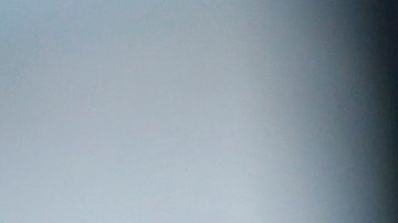 A handcuffed suspect waits inside a police bus during an operation against alleged drug traffickers at the Complexo do Alemao slum in Rio de Janeiro, Brazil, Saturday, Nov. 27, 2010. Soldiers and police crouching behind armored vehicles trained their rifles on dozens of entrances to a sprawling slum Saturday, preparing to invade and try to push drug gangs out an area long considered the most dangerous in Rio de Janeiro, a city set to host the 2016 Olympics. (AP Photo/Felipe Dana)