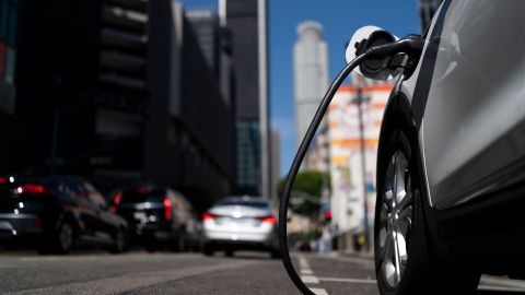 An electric vehicle is plugged into a charger in Los Angeles, Thursday, Aug. 25, 2022. California plans to require all new cars, trucks and SUVs to run on electricity or hydrogen by 2035 under a policy approved Thursday by regulators that seeks a dramatic cut in carbon emissions and an eventual end to gasoline-powered vehicles. (AP Photo/Jae C. Hong)