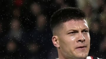 AC Milan's Luka Jovic celebrates after scoring during the Europa League soccer match between Rennes and AC Milan at the Roazhon Park stadium in Rennes, western France, Thursday, Feb. 22, 2024. (AP Photo/Mathieu Pattier)