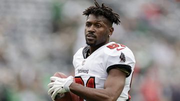 FILE - Tampa Bay Buccaneers wide receiver Antonio Brown (81) walks on the field during an NFL football game against the New York Jets, Sunday, Jan. 2, 2022, in East Rutherford, N.J. Former NFL receiver Antonio Brown’s brief and chaotic tenure as a National Arena League owner appears to be over after the league terminated the Albany Empire’s membership over a failure to make its monthly payments. The NAL on Thursday, June 15, 2023, announced its board of owners unanimously reached the decision after “exhausting all avenues” over the Empire’s refusal to make its past two payments, as well as Brown refusing to pay a $1,000 fine conduct detrimental to the league over recent comments. (AP Photo/Adam Hunger, File)