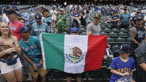 A fan holds up a Mexican flag during batting practice before the MLB All-Star baseball Home Run Derby in Seattle, Monday, July 10, 2023. (AP Photo/Ted Warren)