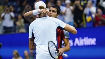 Carlos Alcaraz, of Spain, right, hugs Jannik Sinner, of Italy, after Alcaraz won their match in the quarterfinals of the U.S. Open tennis championships, early Thursday, Sept. 8, 2022, in New York. Alcaraz and Sinner will renew their rivalry on Friday June 7, 2024, in the French Open semifinals. (AP Photo/Frank Franklin II, File)