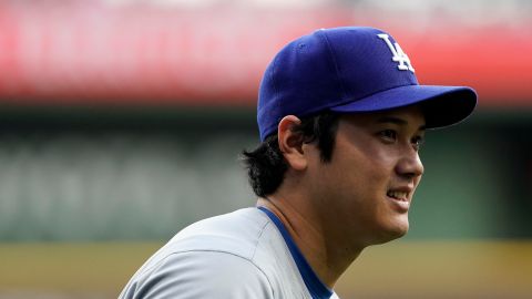 Los Angeles Dodgers' Shohei Ohtani warms up before a baseball game against the Milwaukee Brewers, Tuesday, Aug. 13, 2024, in Milwaukee. (AP Photo/Aaron Gash)