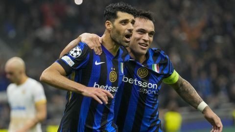 Inter Milan's Mehdi Taremi, left, celebrates with Inter Milan's Lautaro Martinez after scoring his side's fourth goal from penalty spot during the Champions League opening phase soccer match between Inter Milan and Red Star, at the San Siro stadium in Milan, Italy, Tuesday, Oct. 1, 2024. (AP Photo/Luca Bruno)