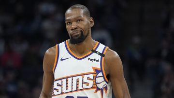Phoenix Suns forward Kevin Durant jogs down the court during the second half of an NBA basketball game against the Minnesota Timberwolves, Friday, March 28, 2025, in Minneapolis. (AP Photo/Abbie Parr)