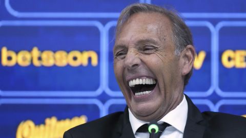 Miguel Angel Russo laughes during his first press conference as Boca Juniors' new head coach in Buenos Aires, Argentina, Monday, June 2, 2025. (AP Photo/Gustavo Garello)
