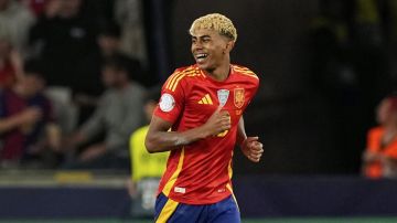 Spain's Lamine Yamal smiles after scoring his side's third goal against France during the Nations League semifinal soccer match between Spain and France at the MHPArena, in Stuttgart, Germany, Thursday, June 5, 2025. (AP Photo/Martin Meissner)