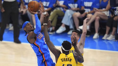 Oklahoma City Thunder guard Shai Gilgeous-Alexander (2) shoots against Indiana Pacers forward Pascal Siakam (43) and guard T.J. McConnell, right, during the first half of Game 2 of the NBA Finals basketball series Sunday, June 8, 2025, in Oklahoma City. (AP Photo/Julio Cortez)