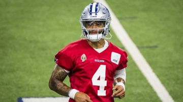 Dallas Cowboys' Dak Prescott looks to the sideline during practice at NFL football minicamp at the Cowboys' facility, Wednesday, June 11, 2025, in Frisco, Texas. (AP Photo/Jessica Tobias)