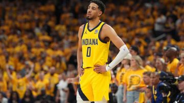 Indiana Pacers guard Tyrese Haliburton watches during the second half of Game 4 of the NBA Finals basketball series against the Oklahoma City Thunder, Friday, June 13, 2025, in Indianapolis. (AP Photo/Michael Conroy)