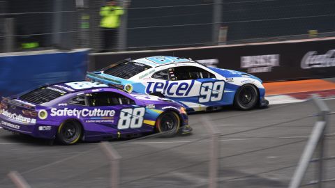 Daniel Suarez (99) and Shane Van Gisbergen (88) drive during a NASCAR Cup Series auto race at Hermanos Rodríguez race track in Mexico City, Sunday, June 15, 2025. (AP Photo/Marco Ugarte)