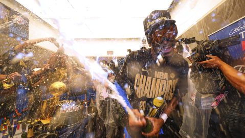 Oklahoma City Thunder guard Shai Gilgeous-Alexander celebrates with teammates in the locker room after winning the NBA basketball championship with a Game 7 victory against the Indiana Pacers Sunday, June 22, 2025, in Oklahoma City. (AP Photo/Julio Cortez)