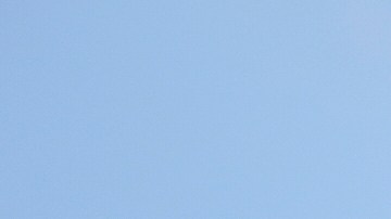 A protester confronts a line of U.S. National Guard in the metropolitan detention center of downtown Los Angeles, Sunday, June 8, 2025, following last night's immigration raid protest. (AP Photo/Eric Thayer)
