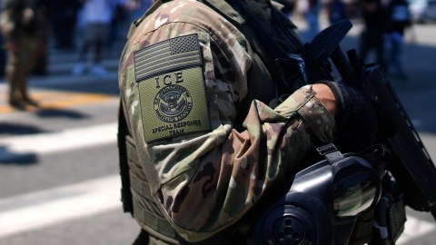 An ICE Special Response Team member stands guard outside the Metropolitan Detention Center, while protesters gathered outside to denounce ICE operations, Tuesday, June 10, 2025, in downtown Los Angeles. (AP Photo/Eric Thayer)