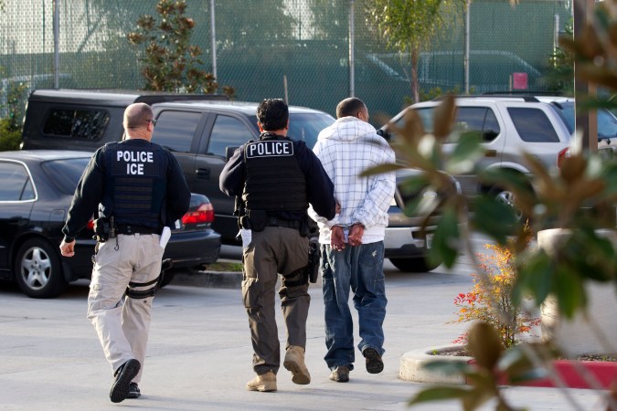 In this March 30, 2012 photo, Immigration and Customs Enforcement (ICE) agents take a suspect into custody as part of a nationwide immigration sweep in Chula Vista, Calif. Federal officials say they arrested more than 3,100 immigrants convicted of serious crimes and fugitives in a six-day nationwide sweep. Officials at U.S. Immigration and Customs Enforcement say the sweep included every state and involved more than 1,900 of the agencys officers and agents. (AP Photo/Gregory Bull)