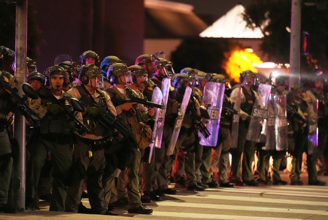 Los Angeles County Sheriff's deputies respond to ICE protests outside the DoubleTree by Hilton Hotel, where ICE agents were believed to be staying, Wednesday, June 11, 2025, in Whittier, Calif. (AP Photo/Chris Pizzello)