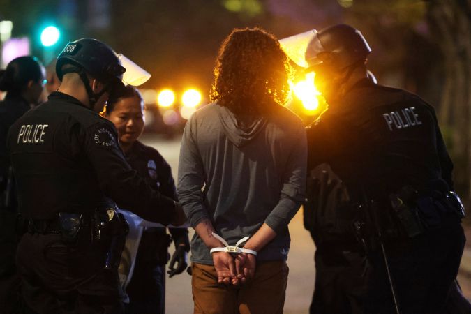 Los Angeles police arrest a protester on Wednesday, June 11, 2025, in Los Angeles. (AP Photo/Ethan Swope)