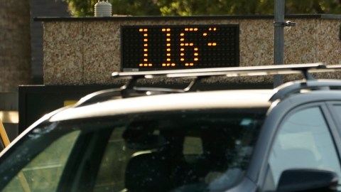 A vehicle passes a bank sign displaying a temperature of 116 degree in Sacramento, Calif., Tuesday, Sept. 6, 2022. The National Weather Service reported the temperature in Sacramento hit a high of 116 degrees, breaking the previous record high of 114. (AP Photo/Rich Pedroncelli)