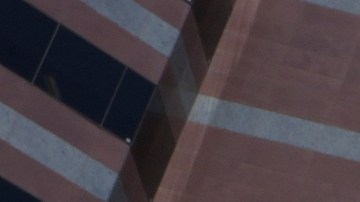 A U.S. Marine stands on guard outside the Metropolitan Detention Center in Los Angeles, on Tuesday, June 16, 2025. (AP Photo/Damian Dovarganes)