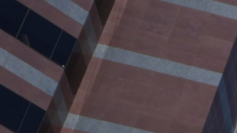 A U.S. Marine stands on guard outside the Metropolitan Detention Center in Los Angeles, on Tuesday, June 16, 2025. (AP Photo/Damian Dovarganes)