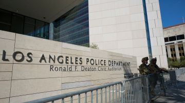 Members of the U.S. National Guard stand outside the Los Angeles Police Department, Wednesday, June 3, 2020, in Los Angeles in response to protests over the death of George Floyd. Floyd died in police custody on Memorial Day in Minneapolis. (AP Photo/Ashley Landis)