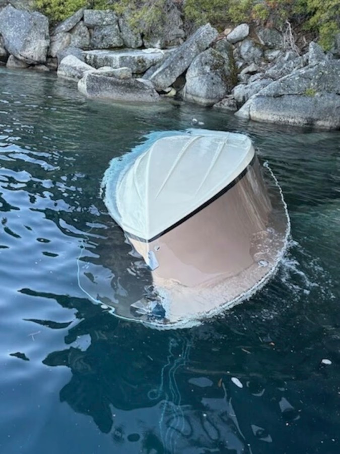 In the photo released by the U.S. Coast Guard, a capsized vessel floats is seen near D.L. Bliss State Park at Lake Tahoe, Calif., June 21, 2025. (Petty Officer 1st Class Justin Smith/U.S. Coast Guard via AP)