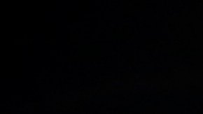 Fireworks explode behind a United States flag during a Fourth of July celebration at State Fair Meadowlands, Saturday, July 4, 2015, in East Rutherford, N.J. (AP Photo/Julio Cortez)