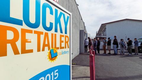 FILE - In this Jan. 13, 2016 file photo, a California Lucky Retailer sign is posted outside the Blue Bird Liquor store as customers wait in line to buy lottery tickets in Hawthorne, Calif. With hours to go and $63 million on the line, the mystery remains: Wheres the winning California Lottery ticket - the one sold last Aug. 8, that is - and why hasnt somebody cashed it? Whatever the reason, it wont be a good enough excuse if the 5 p.m. Thursday, Feb. 4, 2016 deadline passes and nobody produces the ticket at a lottery office. The ticket was sold at a 7-Eleven store in the Chatsworth neighborhood of Los Angeles.(AP Photo/Damian Dovarganes, File)