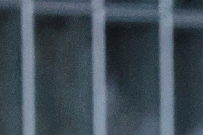 A law enforcement officer escorts a woman out of a protest after she was detained on Wednesday, June 11, 2025, in Los Angeles. (AP Photo/Ethan Swope)