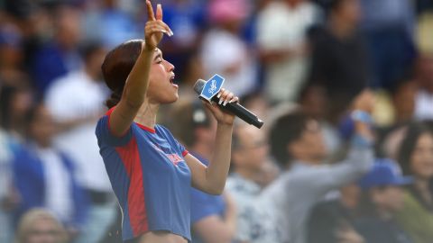 Music artist Nezza sings the national anthem prior to a baseball game between the Los Angeles Dodgers and the San Francisco Giants in Los Angeles, Saturday, June 14, 2025. (AP Photo/Jessie Alcheh)