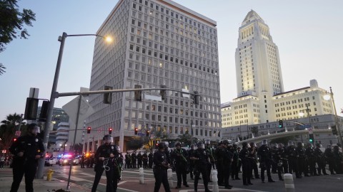 Police block a street during a protest on Tuesday, June 10, 2025, in Los Angeles. (AP Photo/Eric Thayer)