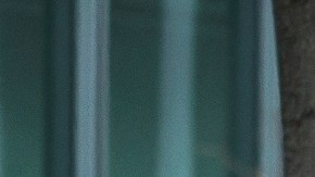 A homeless person covers up with a blanket outside the entrance to the 7th Street/Metro Center subway station in downtown Los Angeles Friday, March 19, 2023. California is bracing with an atmospheric river that forecasters warn will bring heavy rain, strong winds, thunderstorms and the threat of flooding even as the state is still digging out from earlier storms. (AP Photo/Damian Dovarganes)