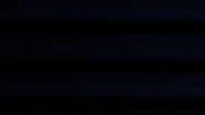 A street vendor wears a mask while working the downtown district Monday, March 30, 2020, in Los Angeles. Over the weekend, more people appeared to heed the message to stay home after beaches and many parks were closed by state and local officials following a swarm of visitors during the first weekend of the state's stay-at-home order in reaction to the coronavirus pandemic. (AP Photo/Marcio Jose Sanchez)