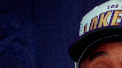 FILE - In this July 12, 1996, file photo, Kobe Bryant, 17, jokes with the media as he holds his Los Angeles Lakers jersey during a news conference in Inglewood, Calif. Bryant was acquired from the Charlotte Hornets by the Lakers in exchange for veteran center Vlade Divac. This was a key moment in the life of a five-time champion and 18-time All-Star. (AP Photo/Susan Sterner, STf)