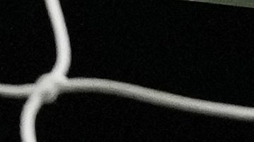 The ball hits the back of the net as West Ham's Tomas Soucek, left, celebrates after scoring the opening goal during the English Premier League soccer match between Arsenal and West Ham at Emirates stadium in London, England, Thursday, Dec. 28, 2023. (AP Photo/Alastair Grant)