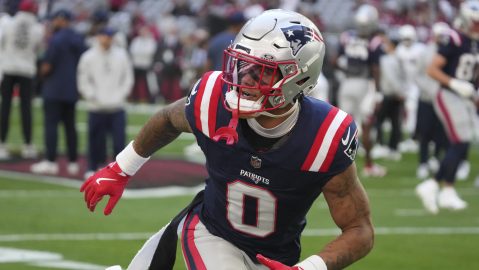 New England Patriots cornerback Christian Gonzalez (0) warms up against the Arizona Cardinals during the first half of an NFL football game, Sunday, Dec. 15, 2024, in Glendale, Ariz. (AP Photo/Rick Scuteri)