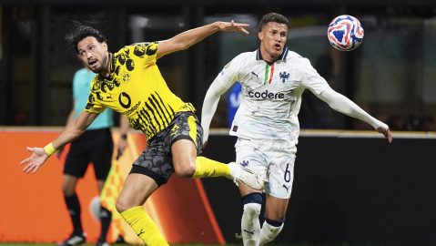 Borussia Dortmund's Ramy Bensebaini, left, and Monterrey's Nelson Deossa battle for the ball during the Club World Cup round of 16 soccer match between Borussia Dortmund and CF Monterrey in Atlanta, Tuesday, July 1, 2025. (AP Photo/Mike Stewart)