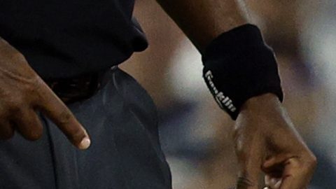 Los Angeles Dodgers' Max Muncy holds his knee after tagging out Chicago White Sox's Michael A. Taylor attempting to steal third base during the during the sixth inning Wednesday, July 2, 2025, in Los Angeles. (AP Photo/Kevork Djansezian)