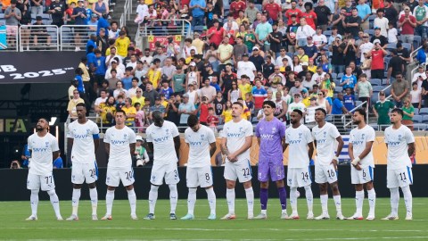 Players of the two teams observe a minute of silence in memory of Portugal international and Liverpool player Diogo Jota and his brother Andre Silva, before the Club World Cup quarterfinal soccer match between Fluminense and Al Hilal in Orlando, Fla., Friday, July 4, 2025. (AP Photo/John Raoux)