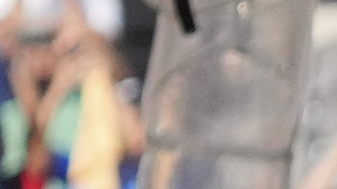 President Donald Trump, back from fourth from right, stands on stage after presenting the championship trophy to Chelsea following the Club World Cup final soccer match between Chelsea and PSG at MetLife Stadium in East Rutherford, N.J., Sunday, July 13, 2025. (AP Photo/Jacquelyn Martin)